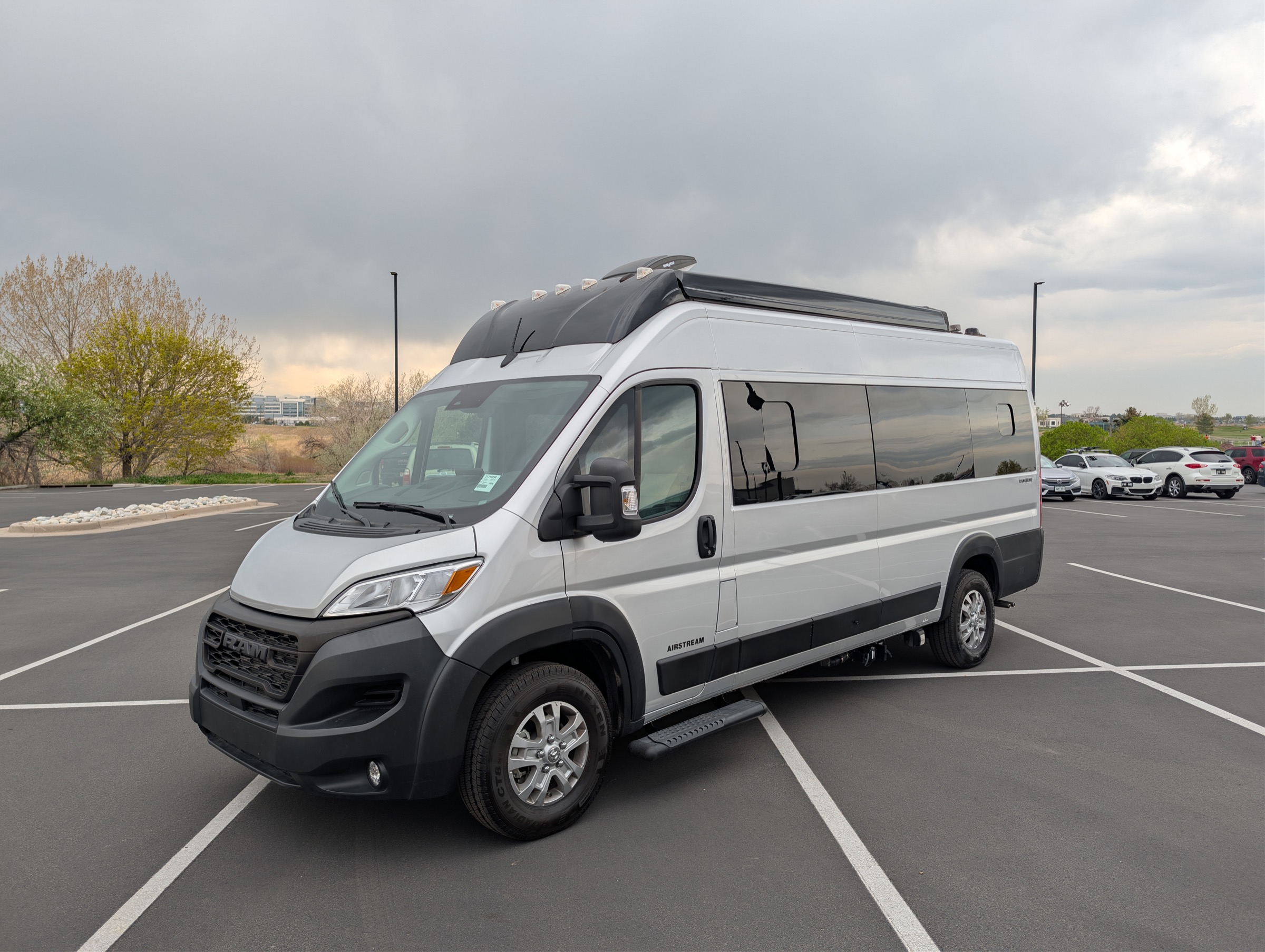 Silver Airstream Rangeline Class B camper van, front driver-side exterior view, available as a Colorado RV rental from rent-rv.co.